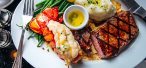 Surf and turf lobster and steak with mashed potatoes